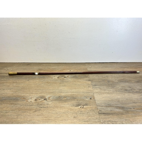 565 - A vintage SAS cane and brass swagger stick - approx. 92cm long