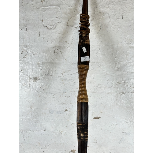 567 - A vintage wood and wicker long bow - approx. 156cm long