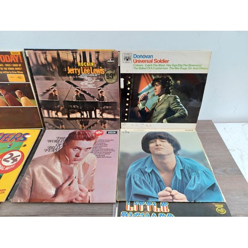 723 - A collection of vinyl records to include Ry Cooder, Joe Walsh, 'Where Guitar is King', J.J. Cale, Pa... 