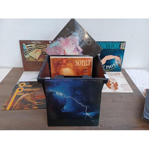 727 - A box containing a large collection of records to include The Blue Nile (sealed), XTC 'Black Sea', J... 