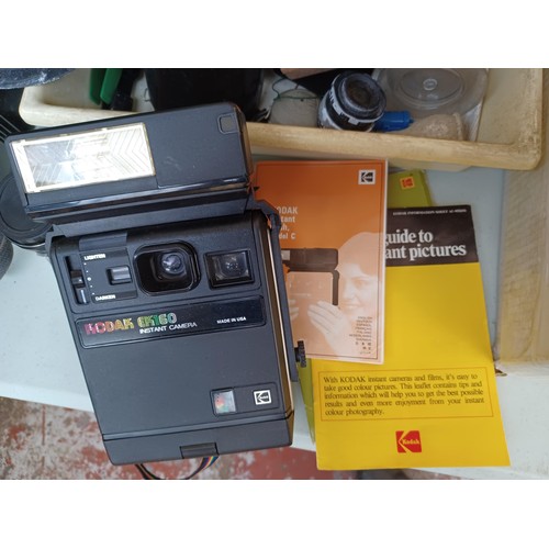 621 - A collection of camera equipment to include Kodak EK160 instant camera fitted with Model C instant f... 