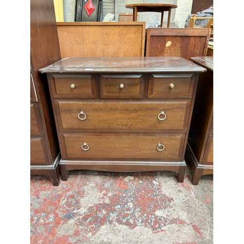 48 - A Stag Minstrel mahogany chest of three short over two long drawers