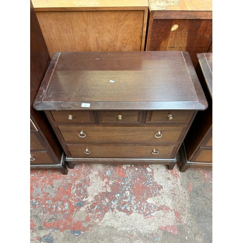 48 - A Stag Minstrel mahogany chest of three short over two long drawers