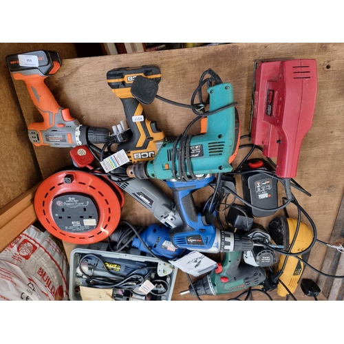 838 - A collection of power tools to include cased Powercraft 240V multitool, cordless hammer drills with ... 