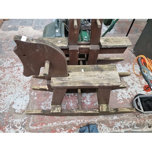 882 - A vintage style wooden outdoor rocking horse