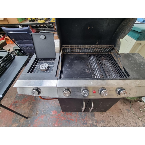 896 - A Kansas four burner gas barbeque with side burner