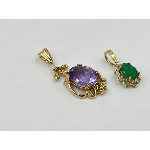 1199 - Two 9ct gold gemstone pendants to include emerald etc. - approx. gross weight 1.64 grams