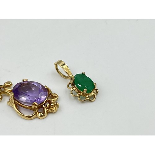 1199 - Two 9ct gold gemstone pendants to include emerald etc. - approx. gross weight 1.64 grams