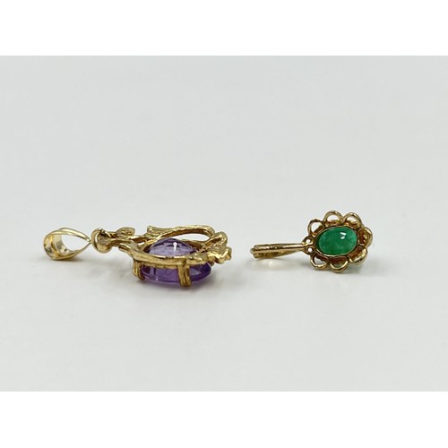 1199 - Two 9ct gold gemstone pendants to include emerald etc. - approx. gross weight 1.64 grams