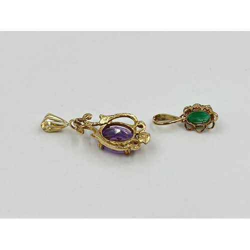 1199 - Two 9ct gold gemstone pendants to include emerald etc. - approx. gross weight 1.64 grams