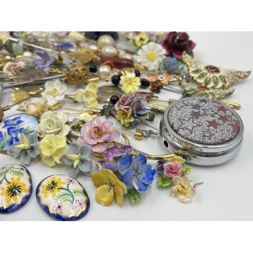 1198 - A large collection of hat pins, trinket boxes and brooches