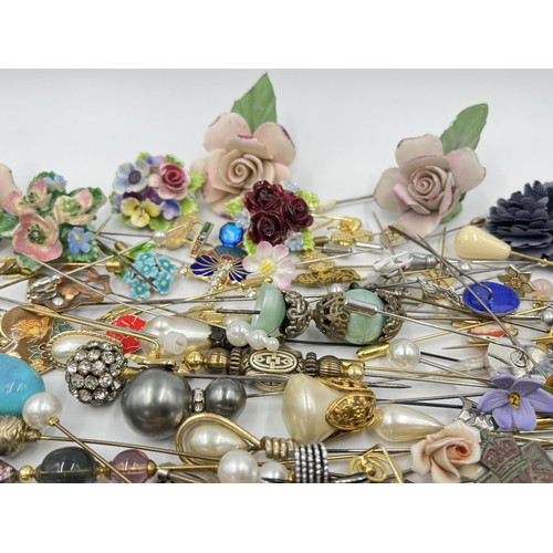 1198 - A large collection of hat pins, trinket boxes and brooches