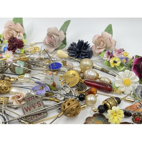 1198 - A large collection of hat pins, trinket boxes and brooches