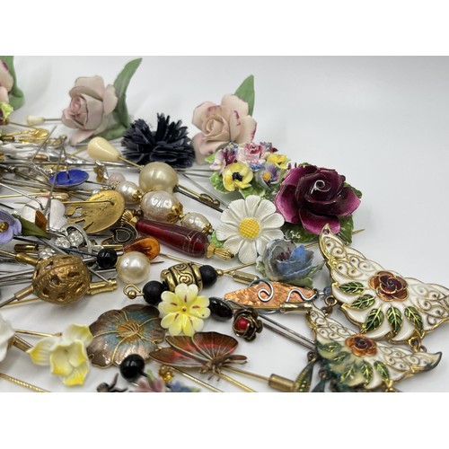 1198 - A large collection of hat pins, trinket boxes and brooches