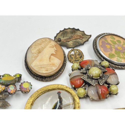 1201 - A collection of vintage costume jewellery to include Miracle brooch, cameo brooch etc.