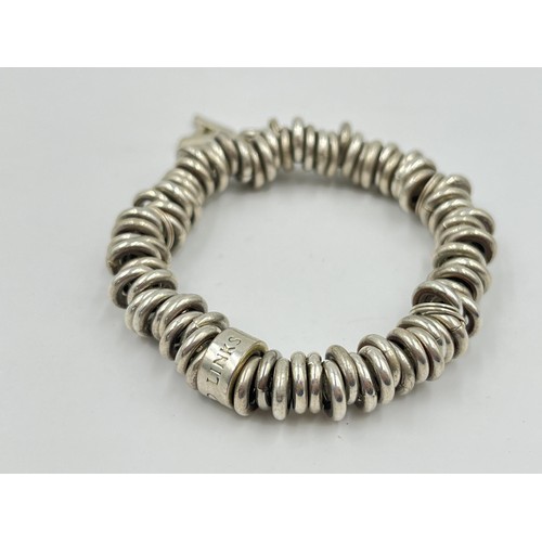 1203 - Two .925 silver bangles, one Links of London and one Pandora - approx. gross weight 62 grams