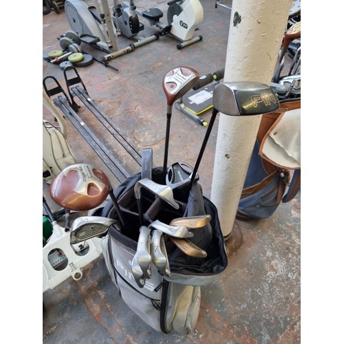 812A - A Ping golf bag containing thirteen golf clubs to include Tailormade S-90+, Ping ST Titanium etc.