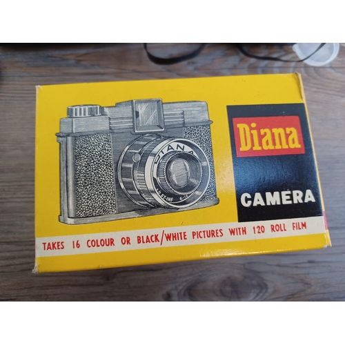 632 - Two boxed vintage lightweight plastic body cameras, one Diana No.151 for 120 roll film with instruct... 