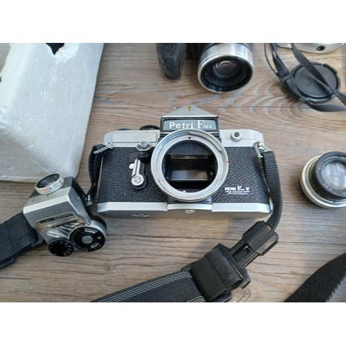 635 - A collection of cameras to include early 1960s Japanese Petri Flex V 35mm SLR body with Petri CdS me... 