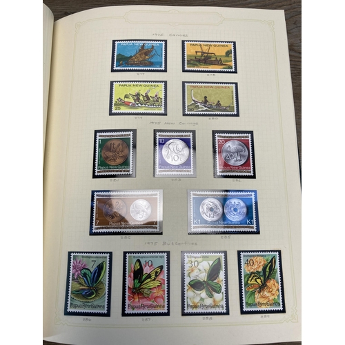 454 - A Stanley Gibbons stamp album containing Papua New Guinea stamps