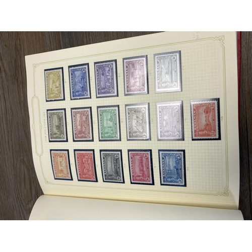 476 - Two Stanley Gibbons stamp albums containing worldwide stamps to include Fiji, Bahamas, Cook Islands,... 