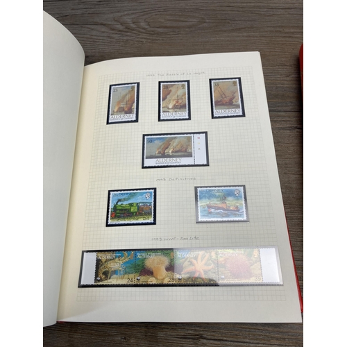 478 - Two Stanley Gibbons stamp albums containing worldwide stamps to include Alderney, Bermuda, Falkland ... 