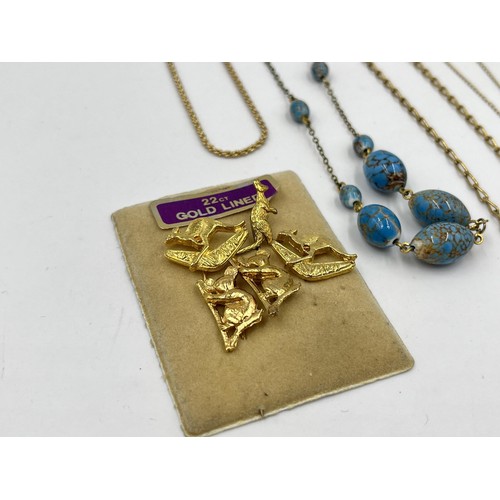 1207 - A collection of 14ct gold filled and plated necklaces together with 22ct gold lined pin badges