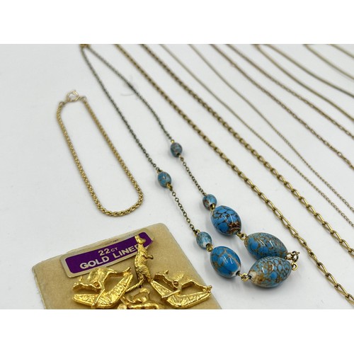 1207 - A collection of 14ct gold filled and plated necklaces together with 22ct gold lined pin badges