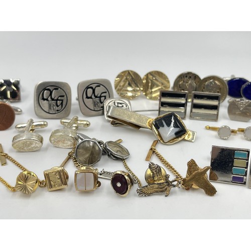 1211 - A collection of cufflinks and tie pins to include Stratton, Rolls Royce etc.