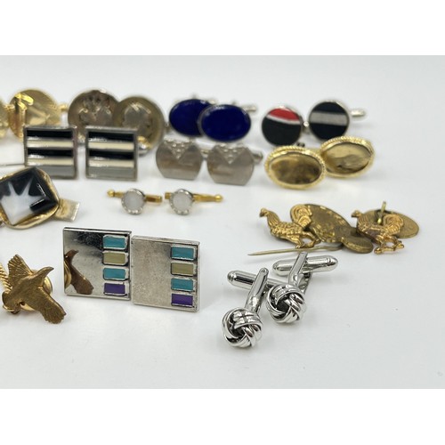 1211 - A collection of cufflinks and tie pins to include Stratton, Rolls Royce etc.