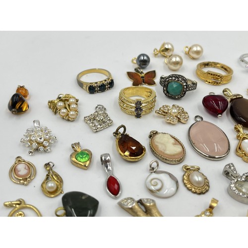 1215 - A collection of pendants and dress rings