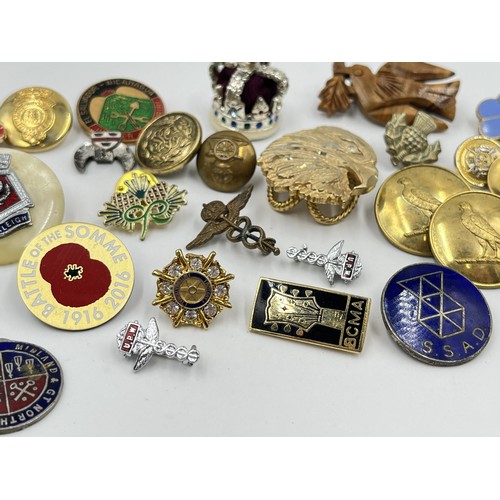 1216 - A collection of badges and buttons to include military etc.