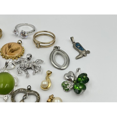 1215 - A collection of pendants and dress rings