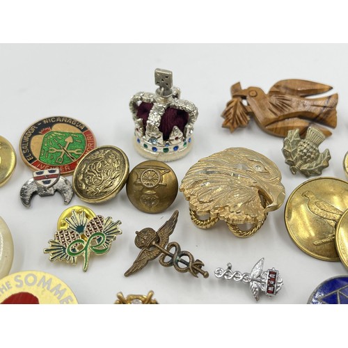 1216 - A collection of badges and buttons to include military etc.