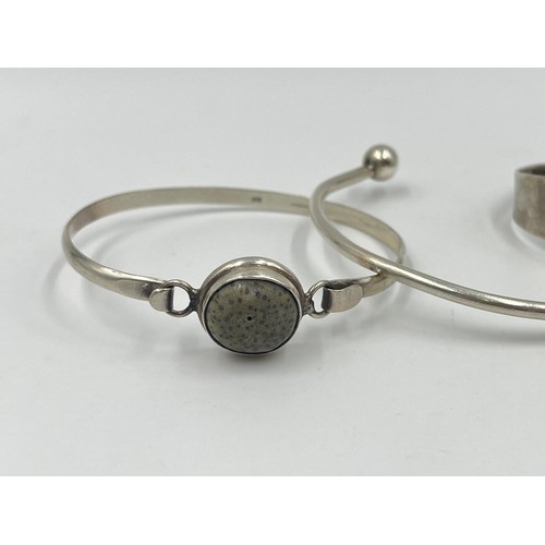 1220 - Four silver bangles and bracelets, two .925 silver and two hallmarked sterling silver - approx. gros... 