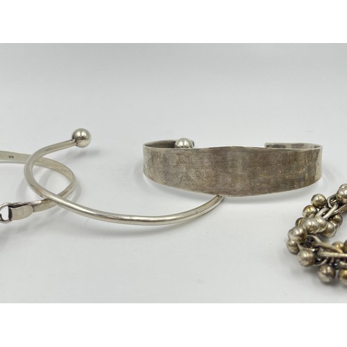 1220 - Four silver bangles and bracelets, two .925 silver and two hallmarked sterling silver - approx. gros... 