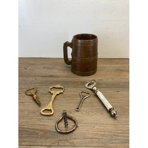 265 - A collection of breweriana to include bottle openers, stainless steel champagne bucket etc.