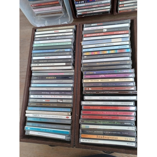 704 - Five boxes containing CDs to include 'Motown Classics', Jess Glynne, Clean Bandit, The Eagles, Robbi... 