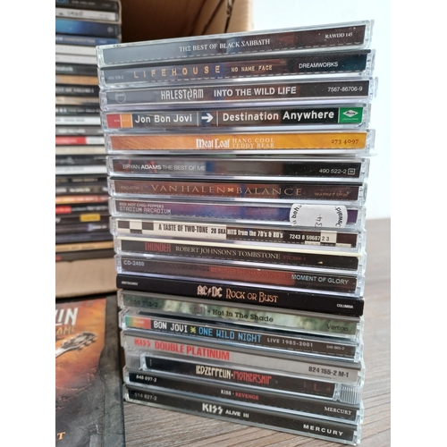 709 - A collection of mostly rock CDs to include ACϟDC, Bon Jovi, Thin Lizzy, My Chemical Romance, Paramor... 