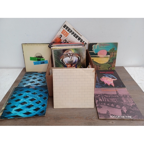 711 - A box containing a collection of vinyl records to include The Who 'Odds & Sods' (Die-cut front, brai... 