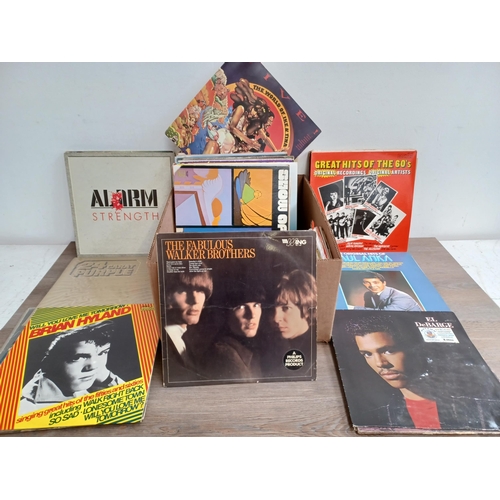 711 - A box containing a collection of vinyl records to include The Who 'Odds & Sods' (Die-cut front, brai... 