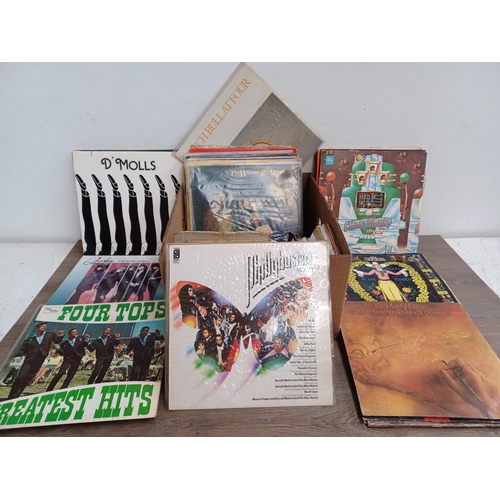 711 - A box containing a collection of vinyl records to include The Who 'Odds & Sods' (Die-cut front, brai... 