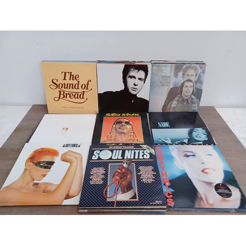 718 - A collection of LP vinyl records to include Cat Stevens, Elton John, Eurythmics, Peter Gabriel, Simp... 