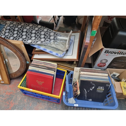 901 - A large quantity of house clearance items to include books, vinyl records, oak framed bevelled edge ... 