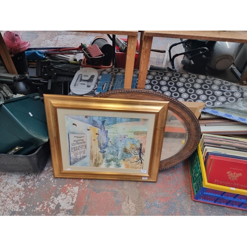 901 - A large quantity of house clearance items to include books, vinyl records, oak framed bevelled edge ... 