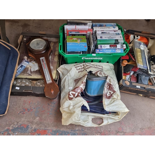 902 - Four boxes containing household items to include two Constellation suitcases, Benn Franks Ltd oak ba... 