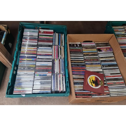 904 - Five boxes and two CD racks containing a large quantity of CDs