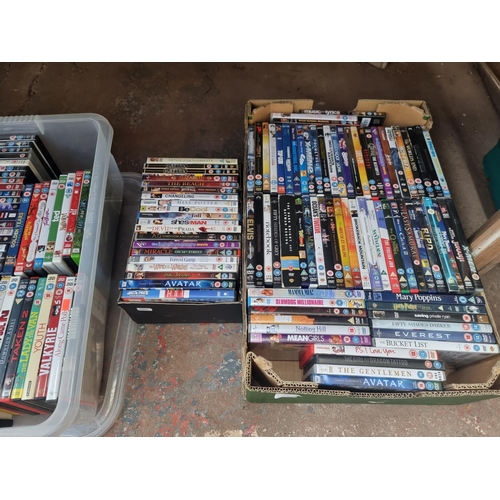 905 - Four boxes containing a large quantity of DVDs