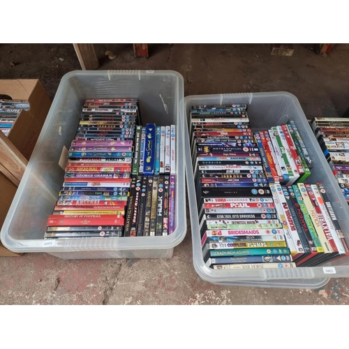 905 - Four boxes containing a large quantity of DVDs