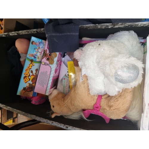 921 - Two bags and one box containing a large quantity of toys to include Mattel Barbie pink plastic car, ... 